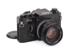 A Canon F1 35mm SLR Camera. Black, Serial number 542267. With a Canon FD 50mm f1.4 S.S.C. lens.