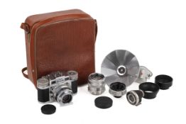 A Braun Super Paxette 35mm Rangefinder Camera Outfit. With three lenses; a Staeble-Choro 38mm f3.