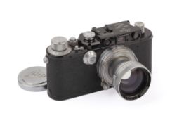 A Leica III Mod F 35mm Rangefinder Camera. Black/Chrome. 1934. Serial number 129776.