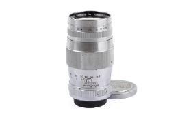 A Canon 135mm f3.5 lens. Chrome. Serial number 49422. Leica Screw Mount. With both caps.