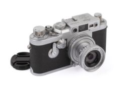 A Leica IIIG 35mm Rangefinder Camera. Chrome, 1957. Serial number 878994. With a Leitz 5cm f2.