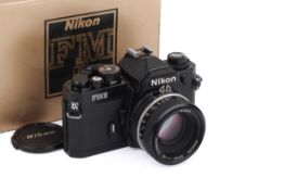 A Nikon FM2N 35mm SLR Camera. Black, Serial number 8693462. With a Nikon 50mm f1.