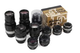 A collection of Nikon F-mount Non-AI lenses. To include a Nikkor 28mm f2.