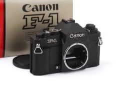 A Canon F1 New 35mm SLR Camera Body. Black, Serial Number 265665. With makers box. Shutter working.