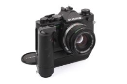 An Olympus OM-2 Spot/Program 35mm SLR Camera. Black. Serial number 1133982. With an Olympus 50mm f1.