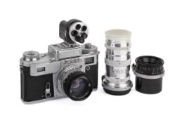 A Kiev 4 35mm Rangefinder Camera Outfit. Chrome. Serial number B 7914644.