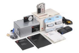 Two Leica compact digital cameras. To include a Digilux Zoom and a C-Lux 2.