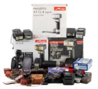 A collection of photographic light and flash meters, and flashes.