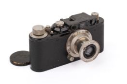 A Leica II 35mm Rangefinder camera. Black/Nickel, 1932. Serial number 104944.