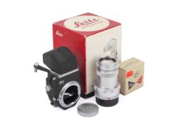 A Leitz 13,5cm f4 Elmar lens, and accessories. Leica M mount.