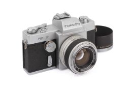 A Topcon RE-2 35mm SLR Camera. Chrome. Serial number 5604744. With a 5.8cm f1.8 RE Auto Topcor lens.