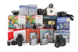 A Collection of mostly Canon and Olympus cameras. All used with makers boxes.