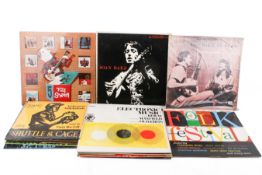 A collection of assorted British and American folk music LP vinyl records.