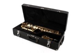 A James & Young alto saxophone in fitted case.
