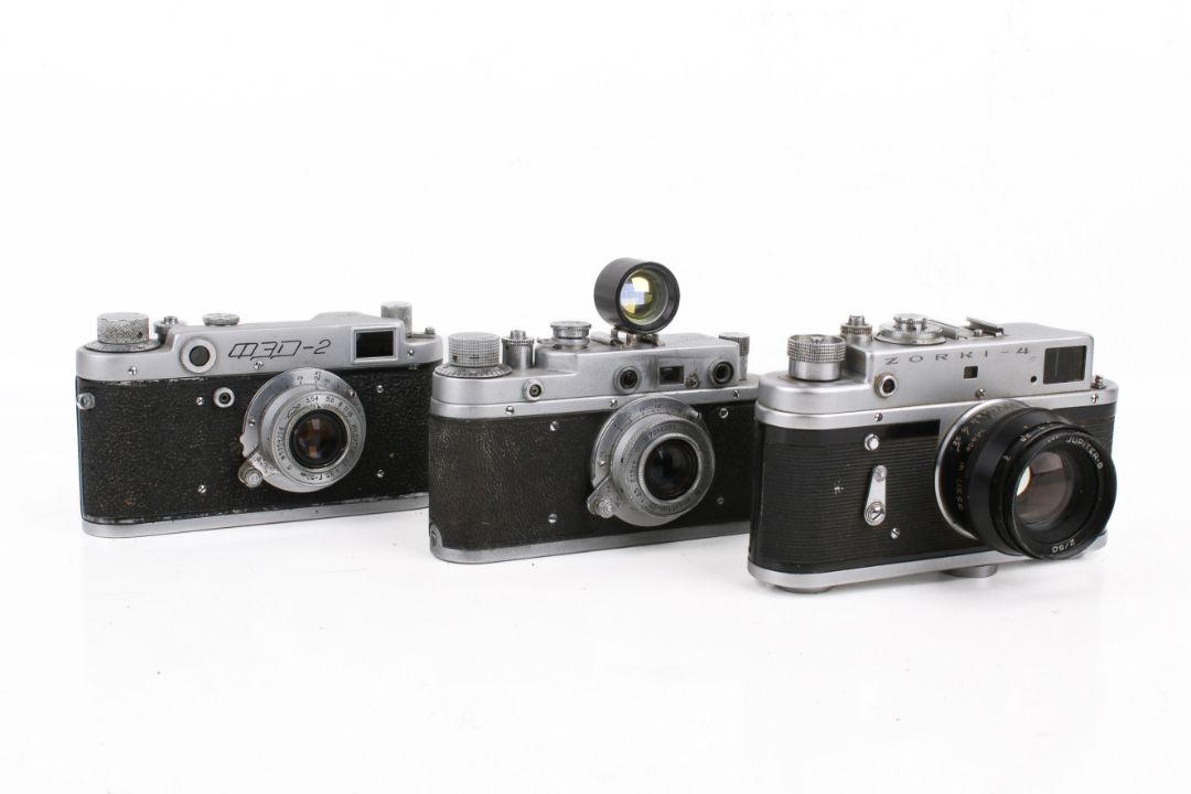 A group of three assorted Soviet rangefinder film cameras. - Image 1 of 2