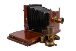 A vintage Lizars mahogany cased bellows plate camera. Having two plates and three brass lenses.