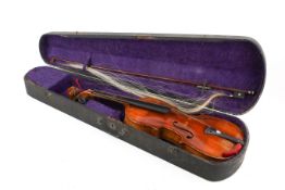 A vintage violin and bow in a wooden coffin shaped case. Body 35.5cm total 58.