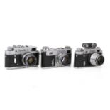 A group of three assorted Soviet rangefinder film cameras.