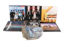 A box of assorted vinyl LP records and Picture Disc singles.