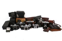 A collection of assorted vintage film cameras.