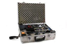 Canon AE-1 Program 35mm SLR film camera outfit, in an aluminium case.