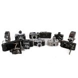 A collection of eleven assorted vintage film cameras.