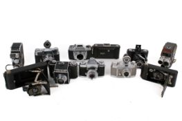 A collection of eleven assorted vintage film cameras.