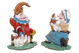 Punch & Judy painted cast metal door stops.