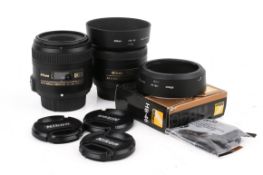 Two Nikon DX AF-S Nikkor camera lenses. Consisting of Micro 40mm 1:2.8G s/n 2077909 and 35mm 1:1.