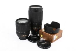 Two Nikon AF camera lenses. Consisting of a DX AF-S Nikkor 18-135mm 1:3.5-5.