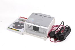 A Canon Selphy ES1 compact photo printer.
