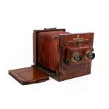 A vintage mahogany cased stereoscopic tailboard plate camera,