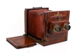 A vintage mahogany cased stereoscopic tailboard plate camera,