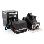 Two vintage Polaroid Land film cameras.