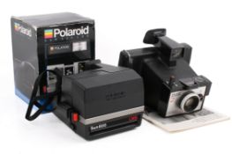 Two vintage Polaroid Land film cameras.