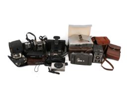 A collection of assorted vintage and modern cameras.