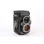 A vintage Rolleiflex TLR medium format 2.8 model film camera.
