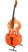 An acoustic three quarter size double bass with stand.