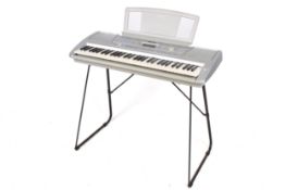 A Yamaha PSR-290 electronic piano keyboard with stand.