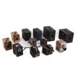 A collection of assorted vintage cameras, mostly box type.