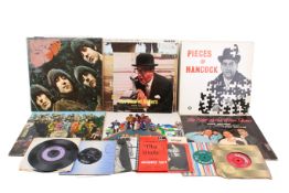 Four assorted The Beatles albums and other LP and singles vinyl records, mostly comedy.