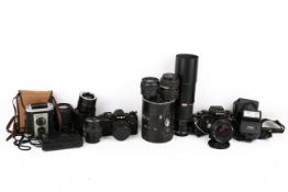 A group of assorted vintage film cameras.