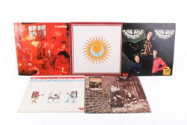 A group of five assorted late 1960 early 70s rock vinyl LP record albums.