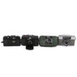 A group of four assorted compact 35mm film cameras.
