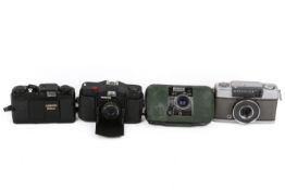 A group of four assorted compact 35mm film cameras.