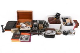 A collection of assorted vintage camera accessories.
