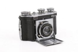 A vintage Dollina Certo Dresden folding rangefinder 35mm film camera.