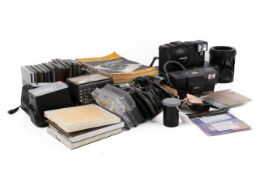A collection of photographic related items, including filters, etc.