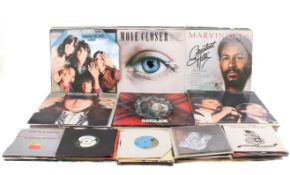 Two boxes of assorted mostly 1970 and 80s LP vinyl album records and singles.