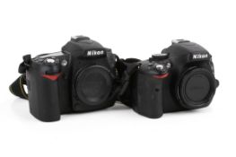 Two Nikon digital SLR camera bodies.